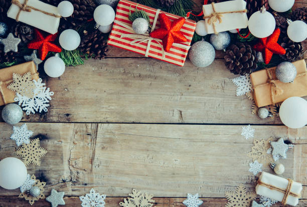 istock Christmas background with gift boxes and decorations on the wood 1077393800