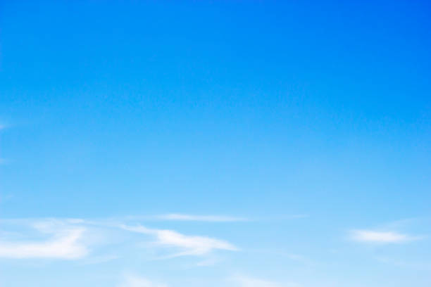 istock Fluffy blue sky background and white clouds soft focus, and copy space 1077403160