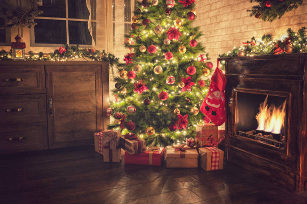 istock Decorated Christmas Tree Near Fireplace at Home 1077407698