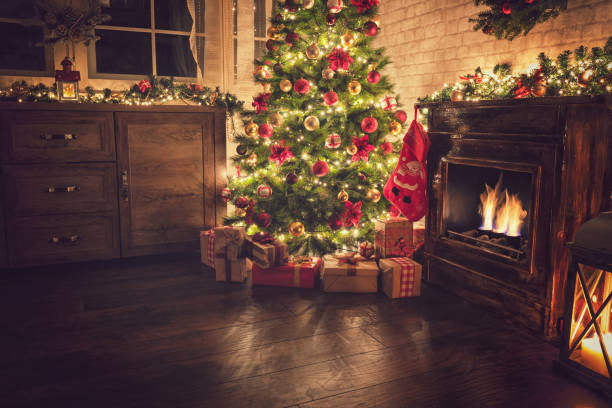 istock Decorated Christmas Tree Near Fireplace at Home 1077407702