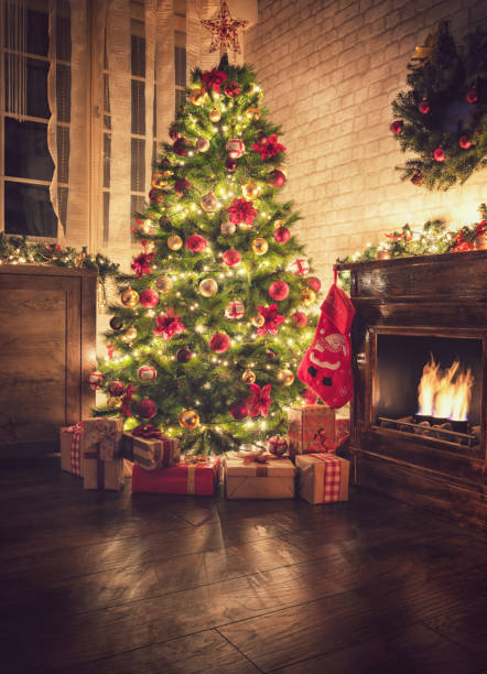 istock Decorated Christmas Tree Near Fireplace at Home 1077407704