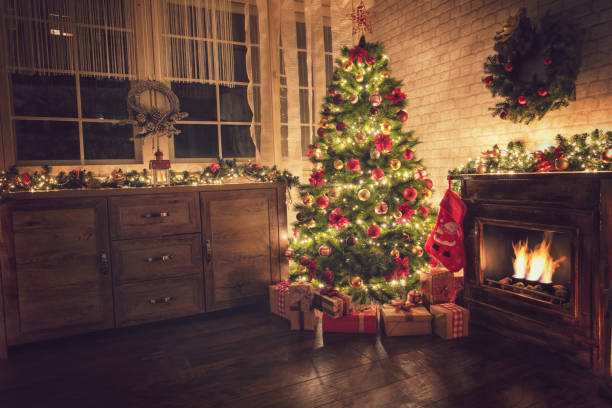 istock Decorated Christmas Tree Near Fireplace at Home 1077407728