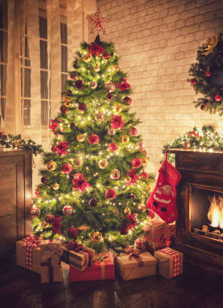 istock Decorated Christmas Tree Near Fireplace at Home 1077407816