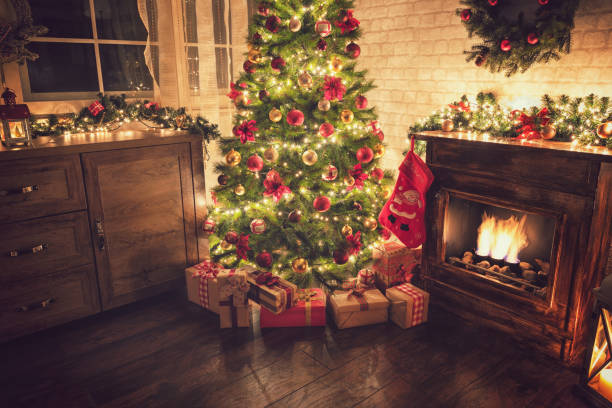 istock Decorated Christmas Tree Near Fireplace at Home 1077407860