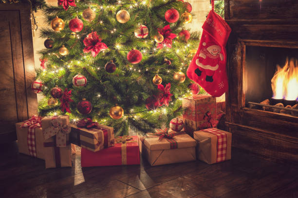 istock Decorated Christmas Tree Near Fireplace at Home 1077407894