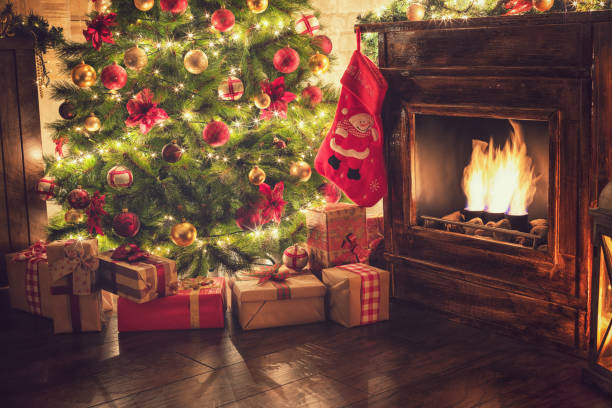 istock Decorated Christmas Tree Near Fireplace at Home 1077407906