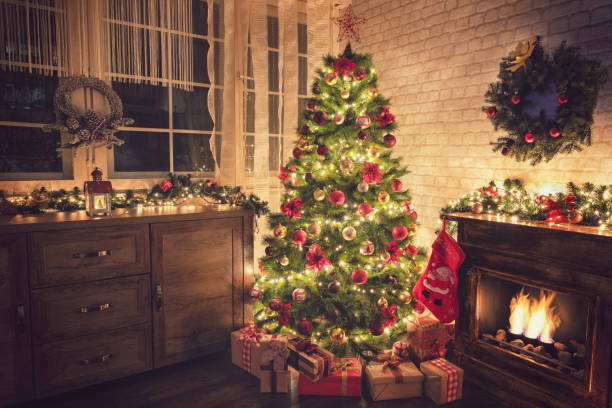istock Decorated Christmas Tree Near Fireplace at Home 1077408940