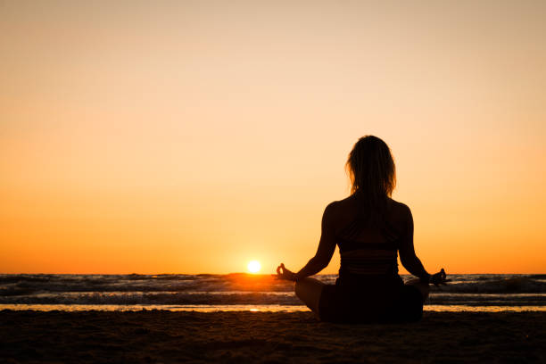 istock Silhouette of a girl practicing yoga 1077409024