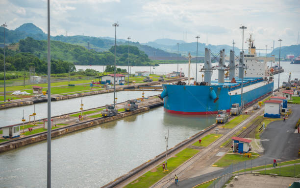 istock Cargo ship passes through lift locks of the Panama Canal. 1077414720