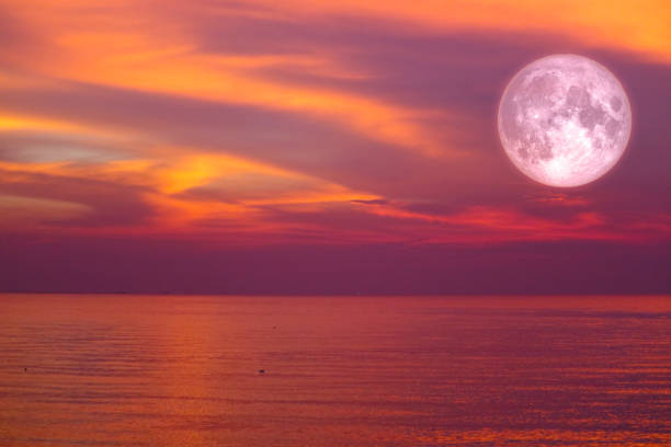 istock christmas moon ,long night moon back cloud over sea in evening 1077416064