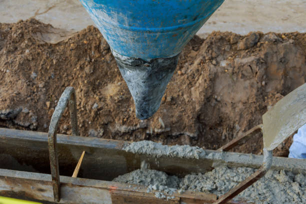 istock Pour concrete from concrete truck, Construction workers pouring concrete, selective focus 1077417622