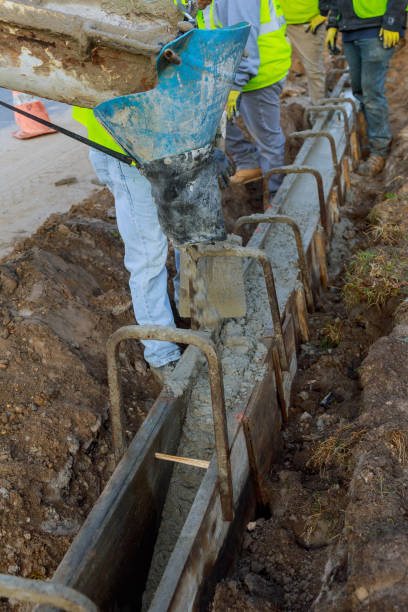 istock Pouring cement during for construction from concrete mixer truck car.selective focus. 1077417630