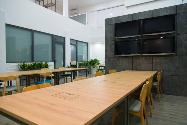 istock Modern conference hall with plasma displays and long tables 1077431272