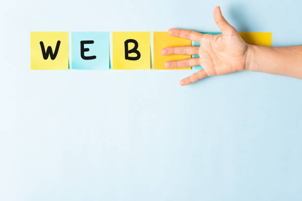 istock Banner web word concept. Collection of different colored sticky note papers with curled corner, open palm hand hidden three notes and empty three notes. 1077433982