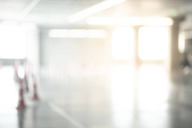 istock Abstract blurred empty parking lot in shopping mall. Defocused background or backdrop for industrial and transportation concepts 1077438690
