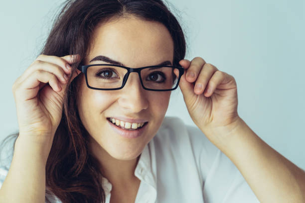 istock Amazed smiling girl trying on spectacles 1077441908