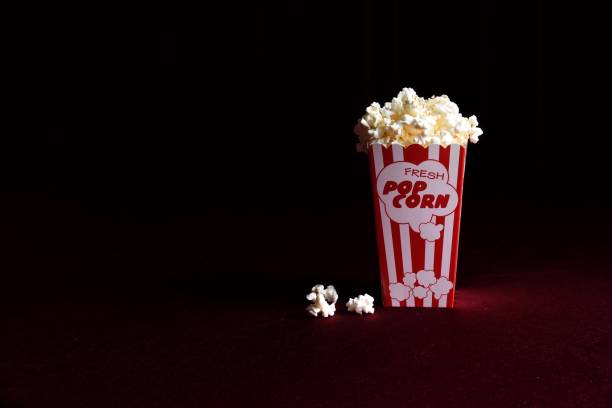istock Close-Up Of Popcorns Against Black Background 1077457614