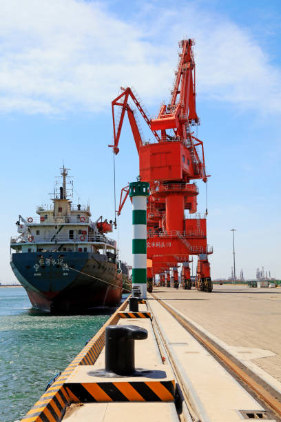 Caofeidian - April 17: cargo ships and tower crane on the freight terminal, on April 17, 2016, caofeidian, hebei province, China \