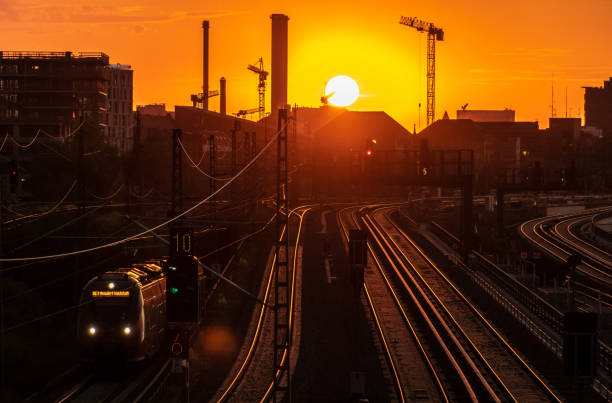 istock High Angle View Of Train On Railroad Track During Sunset 1077459170
