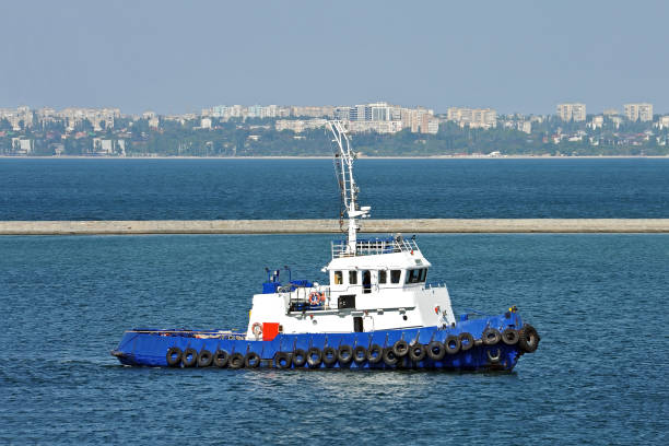 istock Tugboat in harbor quayside 1077459382