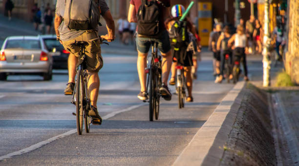 istock People Riding Bicycle On Road In City 1077459908