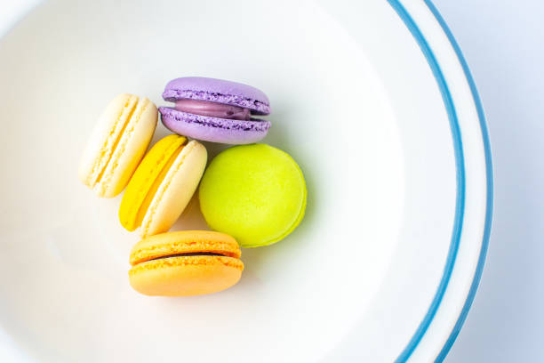 istock Colorful french macarons on white background. 1077461584