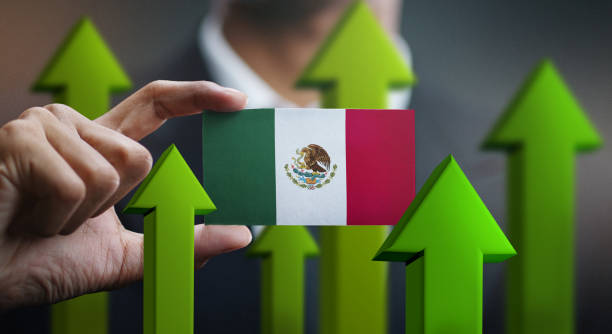 nation growth concept, green up arrows - businessman holding card of mexico flag - mexican flag mexico flag digitally generated image imagens e fotografias de stock