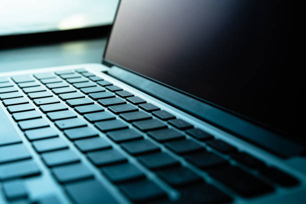 laptop in a black background
