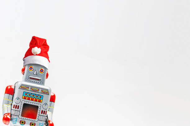 istock Vintage robot retro classic toy with Christmas hat on white background . 1077467102