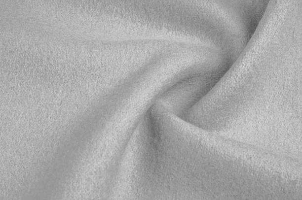 istock Texture, background, pattern. Woolen fabric for outdoor clothing, white gray 1077470496