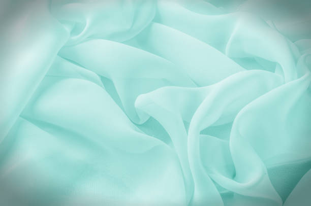 istock Texture, background, pattern. Silk fabric pale pink, abstract folds 1077470538
