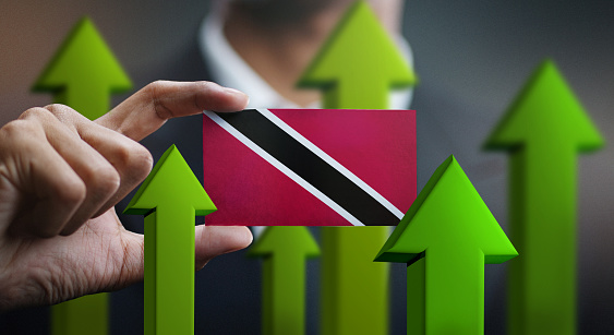 Nation Growth Concept, Green Up Arrows - Businessman Holding Card of Trinidad and Tobago Flag