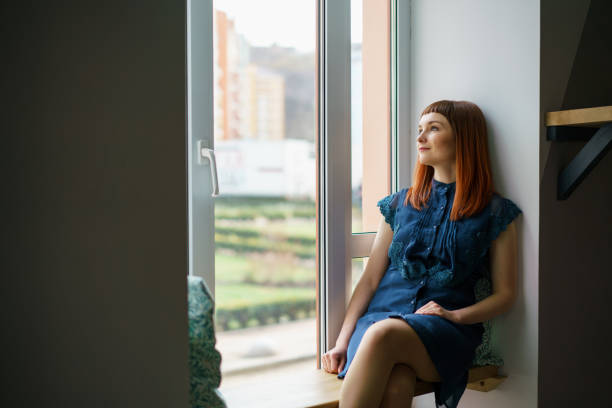 istock Pretty woman sitting in a cafe 1077479230
