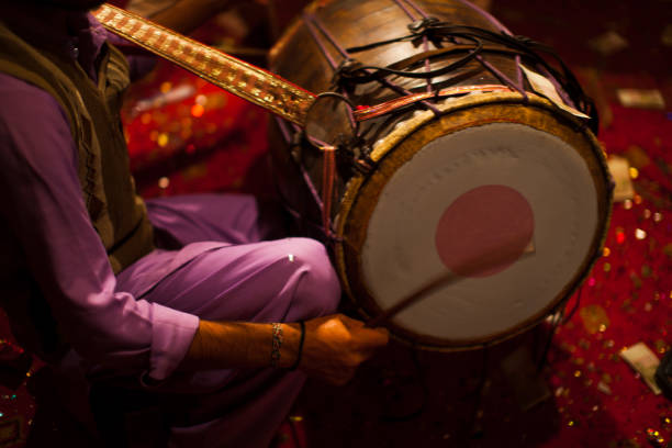 istock A man beating drum in marriage ceremony 1077485754