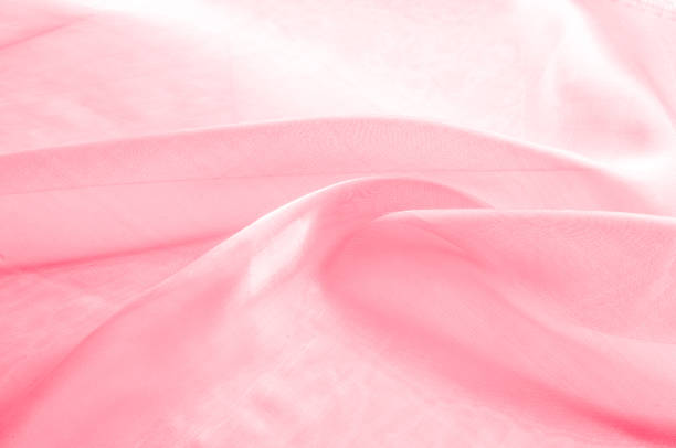 istock Background texture, pattern. Cloth pink silk. Smooth elegant pink silk or satin can use as wedding background. Luxurious valentine day background design. 1077486098