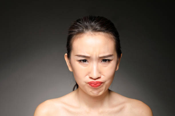 istock woman facial expression 1077493210