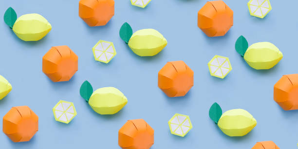 istock citrus made of paper pattern on blue pastel background. 1077494728