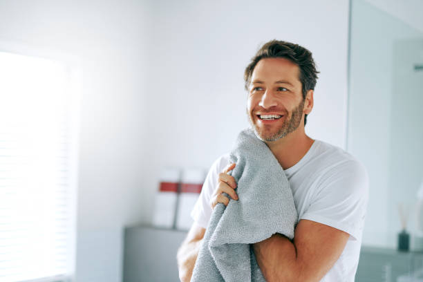 I look like a new man! Cropped shot of a handsome middle-aged man going through is morning routine in the bathroom hair stubble stock pictures, royalty-free photos & images