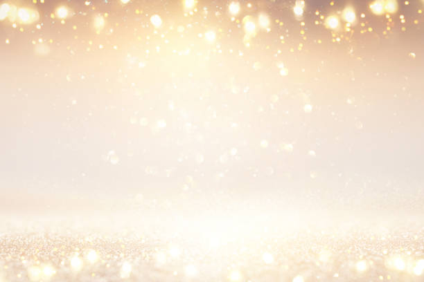 istock glitter vintage lights background. silver and gold. de-focused. 1077499236