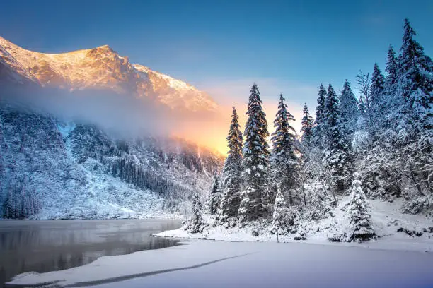 Winter Mountain landscape of Morskie oko in Tatra national park at sunrise. Icy Sea Eye lake in Tatra mountains