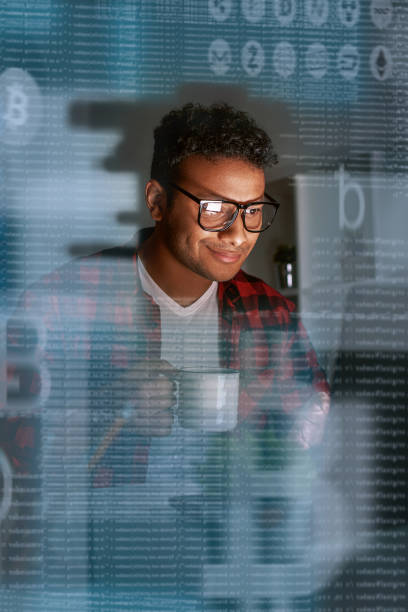 istock Young programmer thinking about ICO and coin success offering 1077503624