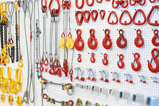 Lifting equipment, hooks and chains Lifting equipment and chains in exhibition store rigging stock pictures, royalty-free photos & images