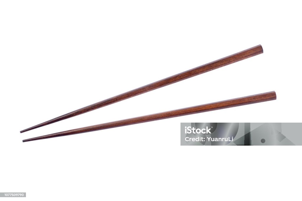 Wooden chopsticks on white background. Chopsticks Stock Photo