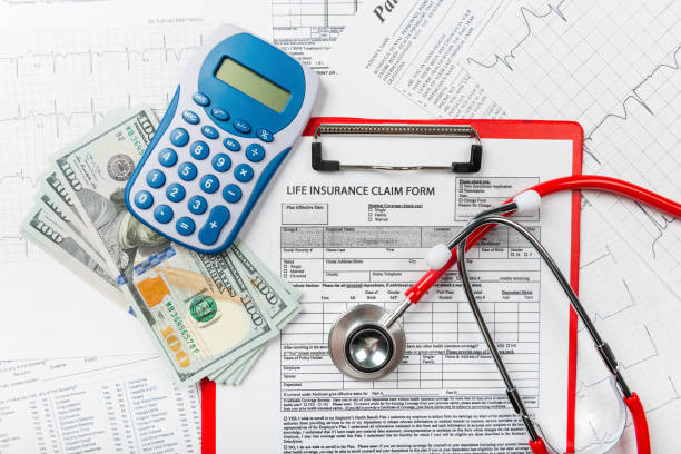 istock Health insurance application form with banknote and stethoscope concept 1077512646