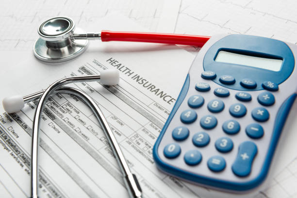 istock Health insurance application form with banknote and stethoscope concept 1077512656