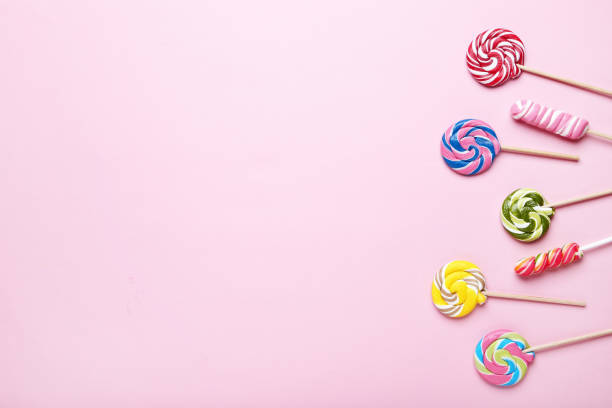 istock Colorful lollipops on pink background 1077514652