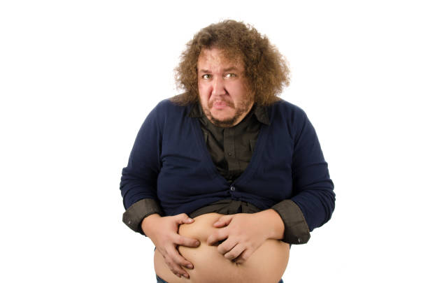 istock Diet and overweight. Funny fat man. 1077515232