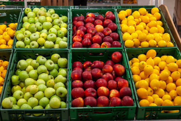 istock A large rack with baskets with different types of apples and lemons in the fruit department of the shopping center. Fresh and healthy foods for every day diet. 1077515512