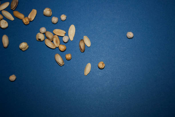 Composition of nuts pattern, flat lay - mix hazelnuts, cashews, almonds on white background. Concepts about decoration, healthy eating and food background.