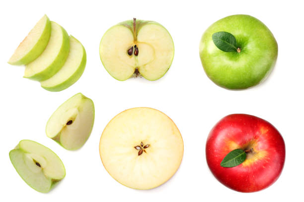 istock green and red apples with slices isolated on white background. top view 1077516946